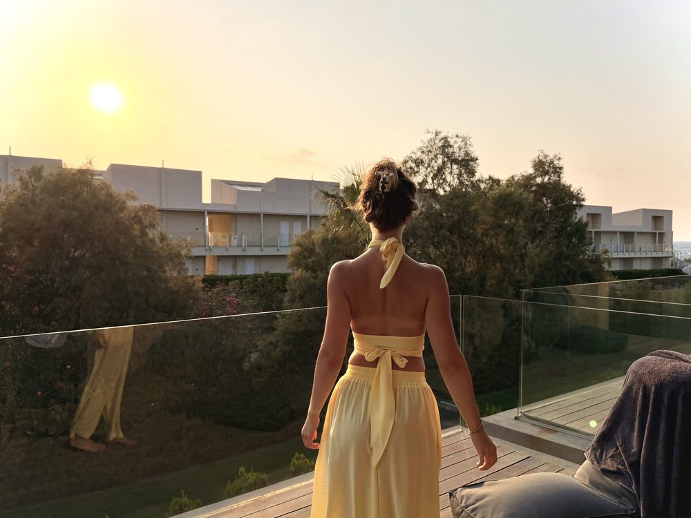 Yellow silk set on a terrace, back view