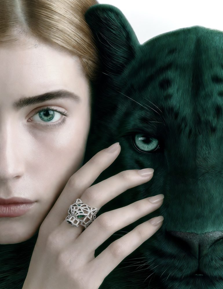 Woman beside an emerald panther, panther ring in focus